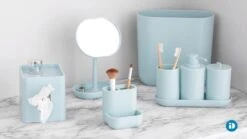 IDesign Cade Oval Slim Trash, Compact Waste Basket Garbage Can For Bathroom, Bedroom, Home Office, Dorm, College-Matte Soft Aqua -Moen Shop 51sSCiKeM0L