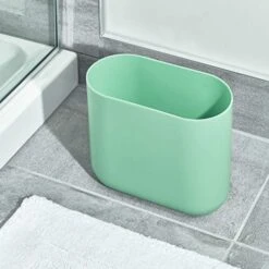IDesign Cade Oval Slim Trash, Compact Waste Basket Garbage Can For Bathroom, Bedroom, Home Office, Dorm, College-Matte Soft Aqua -Moen Shop 51wZ6ExzeAL